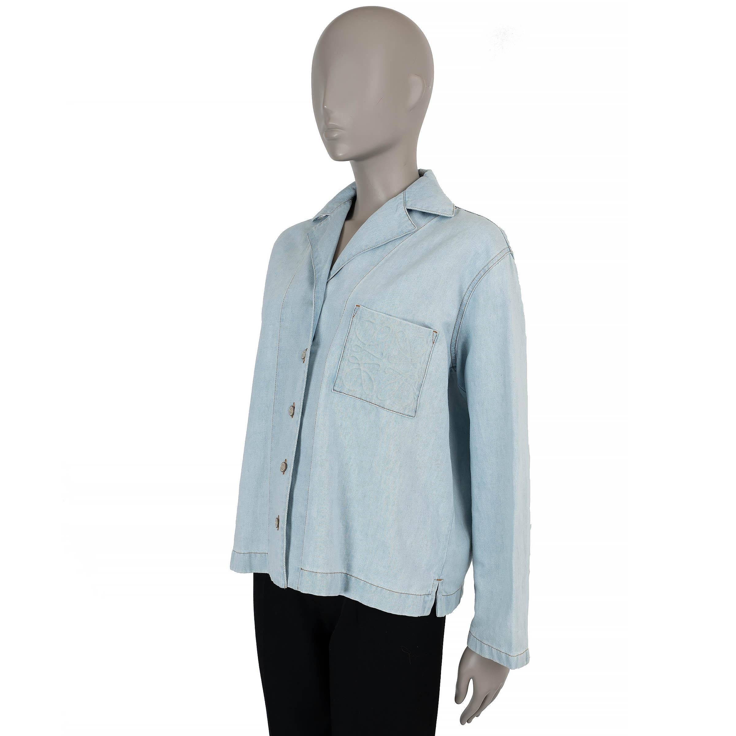 This 100% authentic Loewe pajama denim shirt in light blue cotton (63%) and linen (37%) blends casual ease with refined craftsmanship. Designed with an oversized fit, it features a relaxed camp collar and an Anagram-embossed chest pocket for a