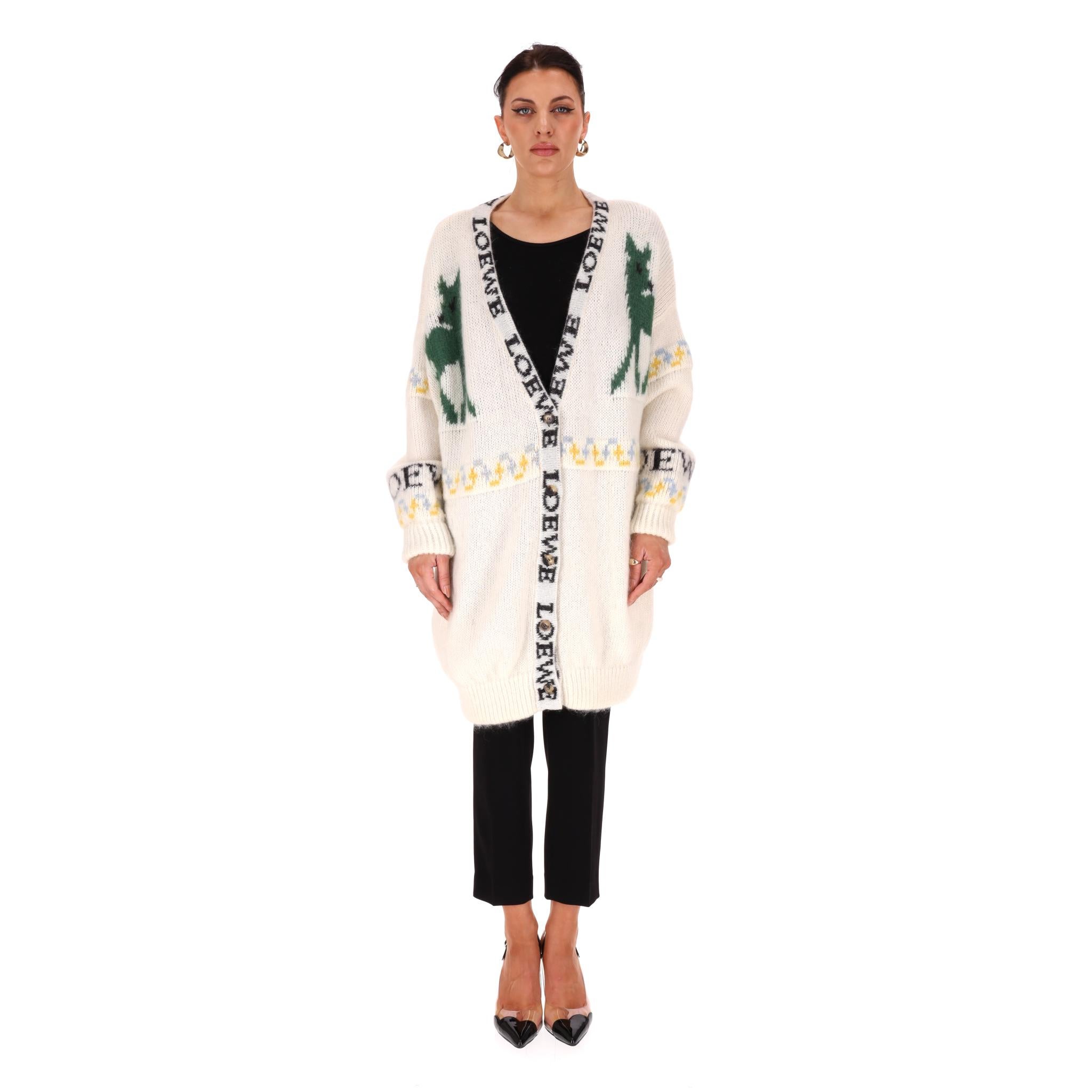 Loewe Logo Oversized Mohair Deer Cardigan

Ivory knitwear crafted from mohair with black 'Loewe' logo trim to the centre and to the sleeves.

Featuring jacquard multicoloured motifs and green Deer pattern to rear.

Styled in an oversized fit with
