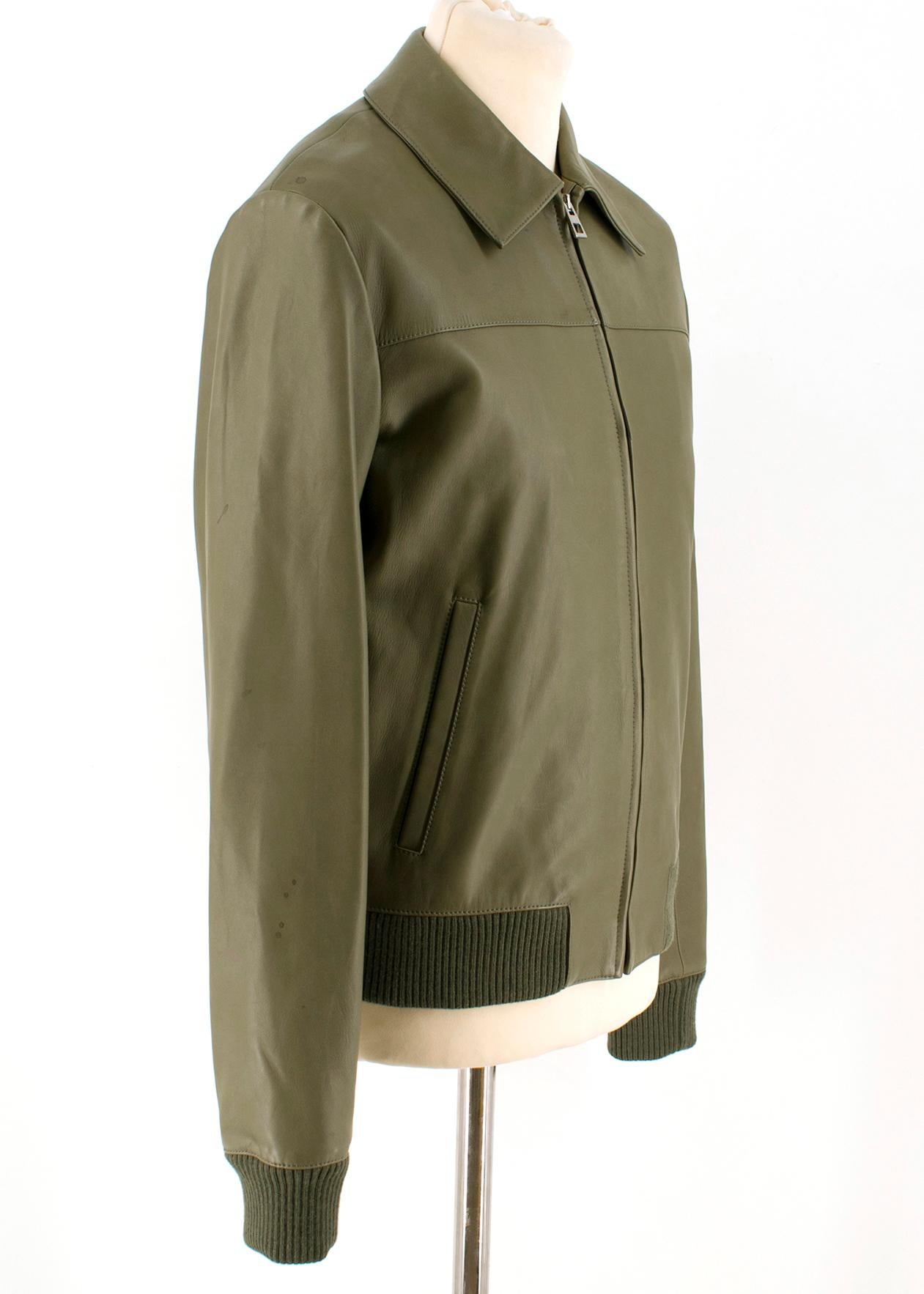 Loewe Men's Khaki Soft Leather Jacket

-Green leather jacket with  
-Ribbed wool hem,
-Collared 
-Zip fasten
-Two exterior pockets 
-Two interior pockets
-Wool ribbed cuffs
-Cotton interior lining 

Please note, these items are pre-owned and may