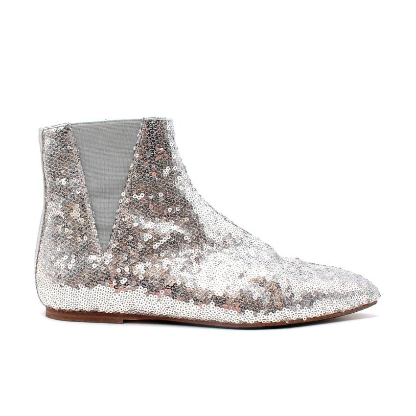 Loewe Metallic Silver Sequined Flat Ankle Boots
 

 - Flat ankle boots with an almond toe
 - Metallic silver sequin upper
 - Tonal elasticated side inserts
 

 Materials:
 Leather
 

 Made in Spain
 

 PLEASE NOTE, THESE ITEMS ARE PRE-OWNED AND MAY