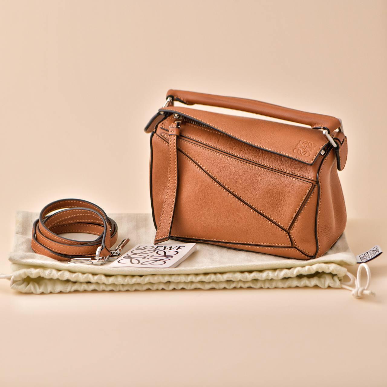 SKU	77701326
Comes With	Loewe Dust Bag, Shoulder Strap and Dandelion Authenticity Guarantee Only
RRP	£1,900 Incl. Taxes / €2,100 Incl. Taxes / $2,650 Excl. Taxes
Model	Mini Puzzle
Serial Number	01****
Materials	Canvas,