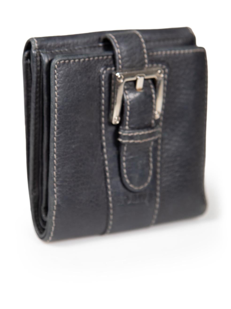 CONDITION is Good. Minor wear to wallet is evident. Light wear to strap with creasing. Abrasions are seen throughout on this used Loewe designer resale item.
 
 
 
 Details
 
 
 Navy
 
 Leather
 
 Wallet
 
 Bifold
 
 Buckle detail
 
 Snap button