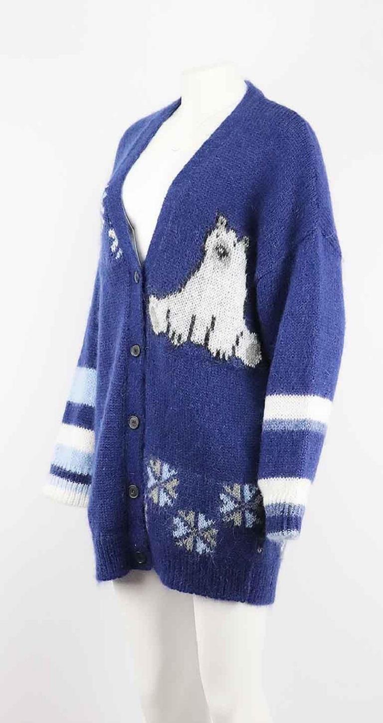 This cardigan by Loewe is spun in Italy from a cosy mohair-blend with touches of wool and has an oversized, enveloping silhouette with a ribbed, longline hem, it is playfully intarsia-knitted with polar bears, snowflakes and floating ice caps.