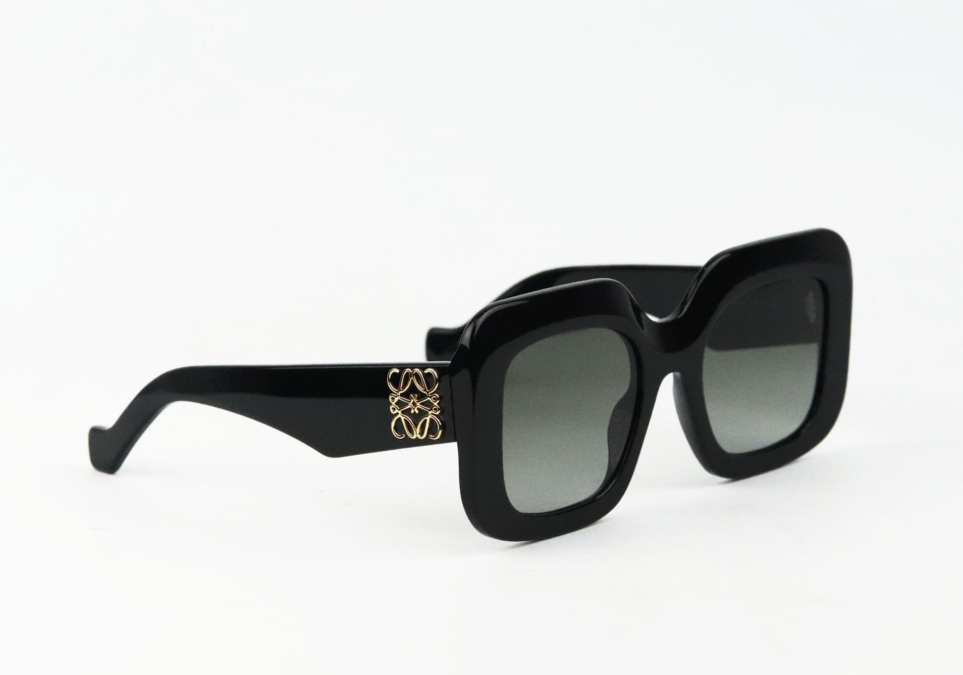 Loewe's accessories are as recognizable as its cult bags - these sunglasses are detailed with the brand's gold 'Anagram' hardware at the temples, they've been made in Italy from glossy black acetate with oversized square frames that'll suit softer