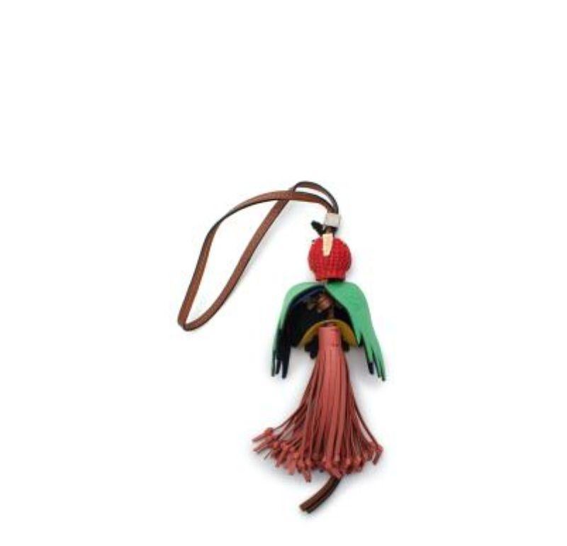 Loewe Paula's Ibiza Parrot Charm
 
  - Basketweave raffia and leather multicoloured parrot charm
 - Woven head, cut out leather wings, and a knotted tassel tail
 - Set on a stitched leather strap with adjustable square bead 
 
 Materials 
 Leather 
