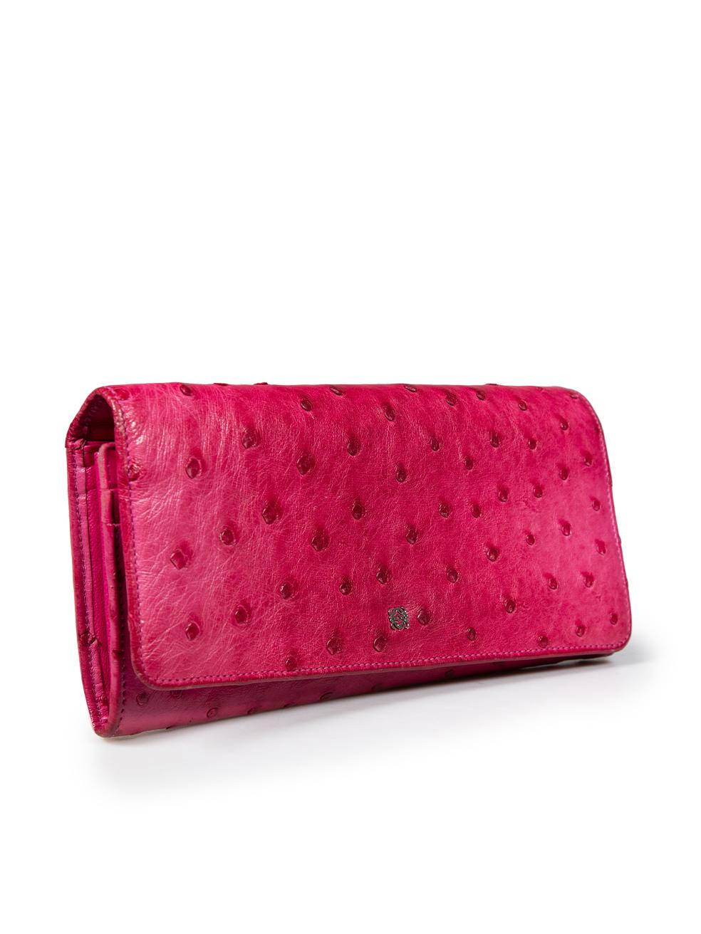 CONDITION is Good. General wear to wallet is evident. Moderate signs of wear on the front and back borders, around the edges, inside the card compartments, on the leather logo, and along the cash folds with discolouration and abrasion on this used