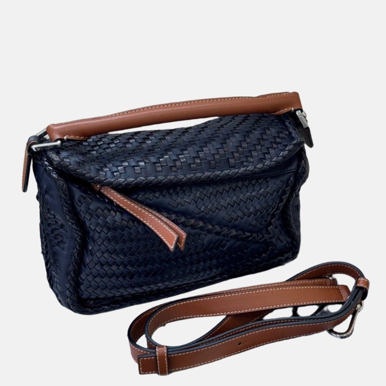 Loewe Puzzle Small Leather Woven Braided Navy Crossbody Bag
 These are professional photos of the actual bag.
 
 Expertly crafted from premium calfskin leather, this crossbody bag is meticulously woven together from strips of the same material. The