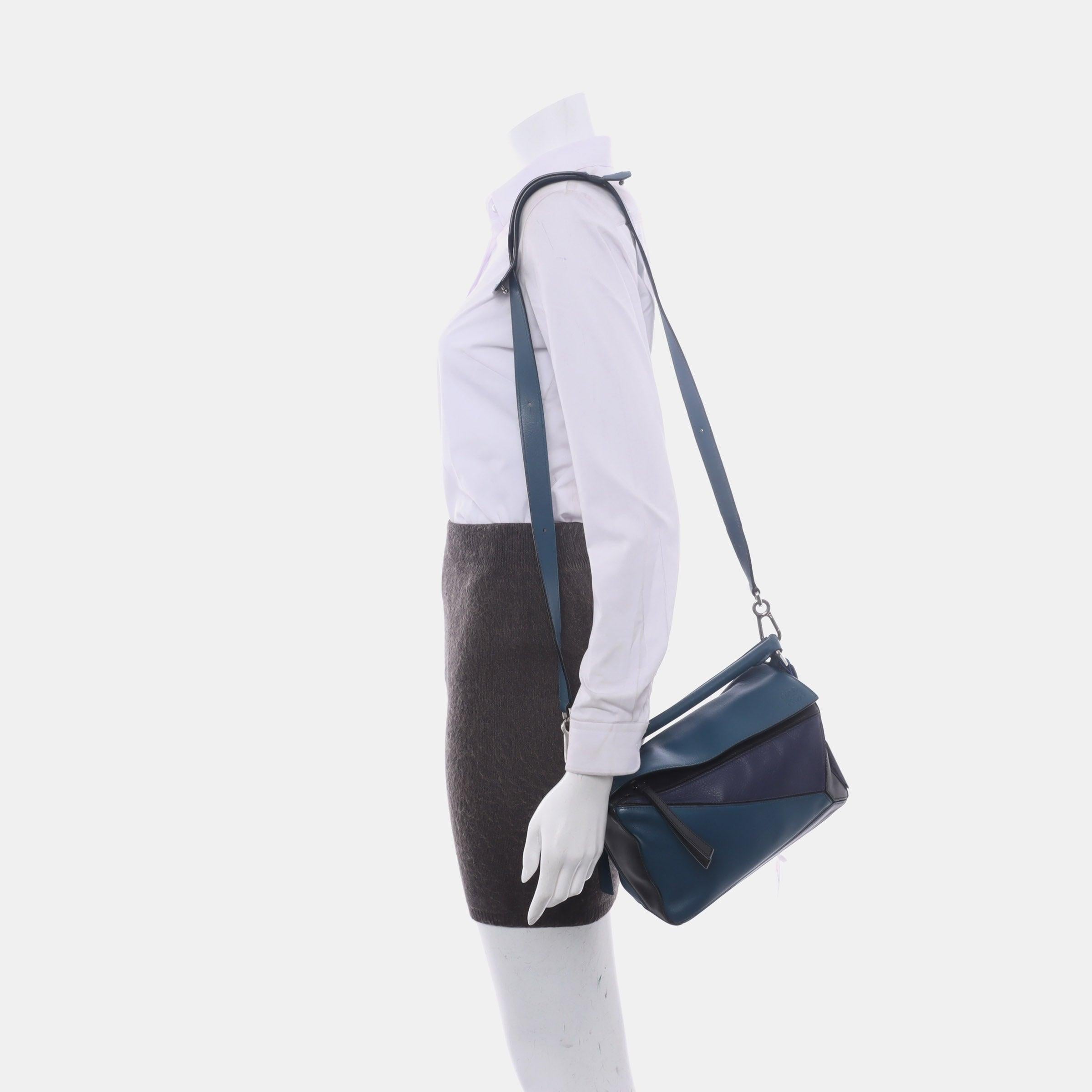 Loewe Puzzle Small Multicolor Navy Calfskin leather bag
 These are professional photos of the actual bag.
 
 Loewe's Puzzle bag is a timeless classic cult piece. Crafted from supple calfskin leather and finished with silver hardware and signature