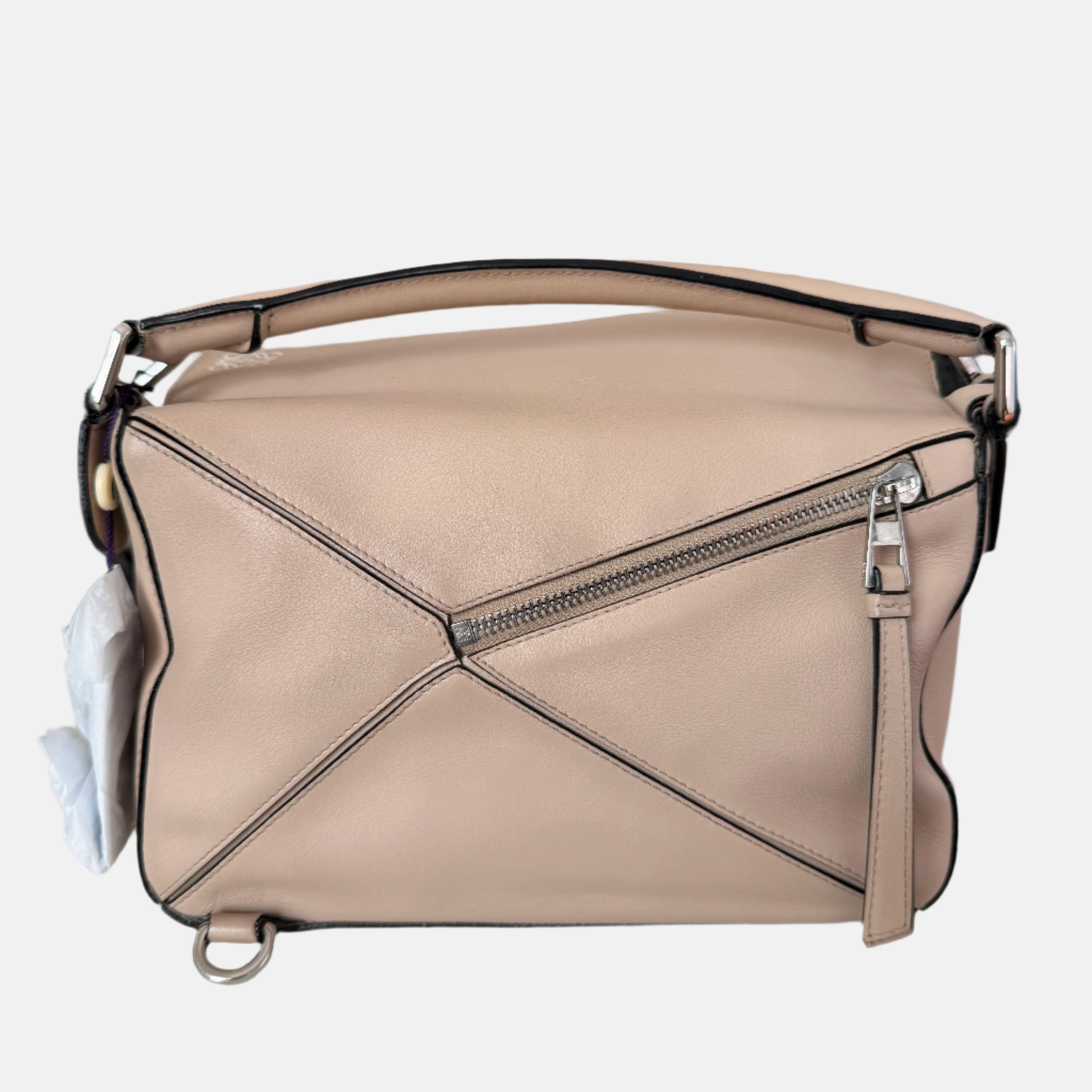 Loewe Puzzle Small Sand Beige Crossbody Bag
 These are professional photos of the actual bag.
 
 CONDITION: EXCELLENT
 This preloved item is in excellent condition with light signs of wear. Light scratches on the base and the hardware.
 DETAILS:
 
