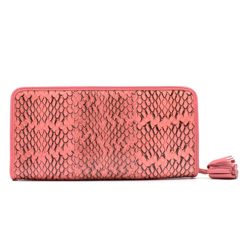 Loewe Python Leather Wallet

- Pink python leather 
- Loewe logo plague to the front
- Silver-tone hardware
- Exposed zip closure
- Leather tassel zip pull
- 8 card slots
- 2 large note slots
- 1 interior coin compartment

Please note, these items