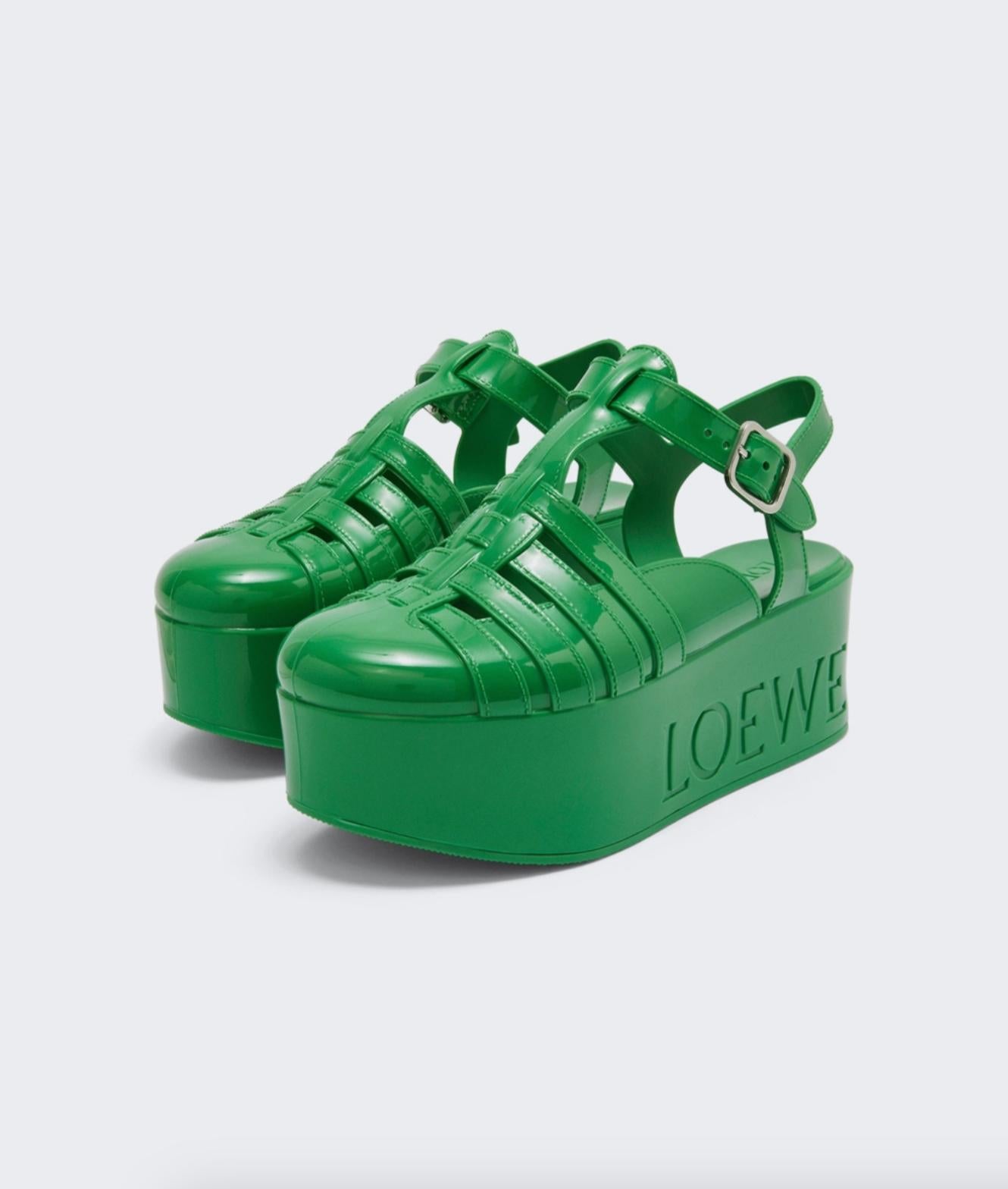 These Loewe sandals exemplify the brand’s love for vibrancy and flair. Made from rubber, this wedge style features dramatic platforms and intertwining straps. Brand new, never worn or owned.