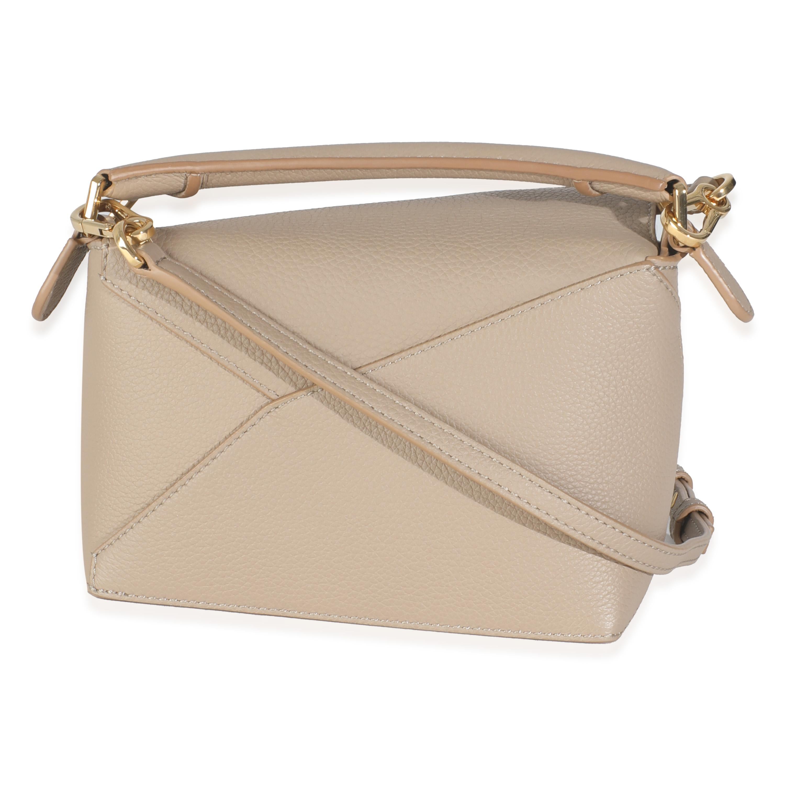 Listing Title: Loewe Sand Calfskin Mini Puzzle Edge Bag
SKU: 145709
Condition: Pre-owned 
Handbag Condition: Excellent
Condition Comments: Item is in excellent condition and displays light signs of wear. Faint scuff along corner. Light scratching