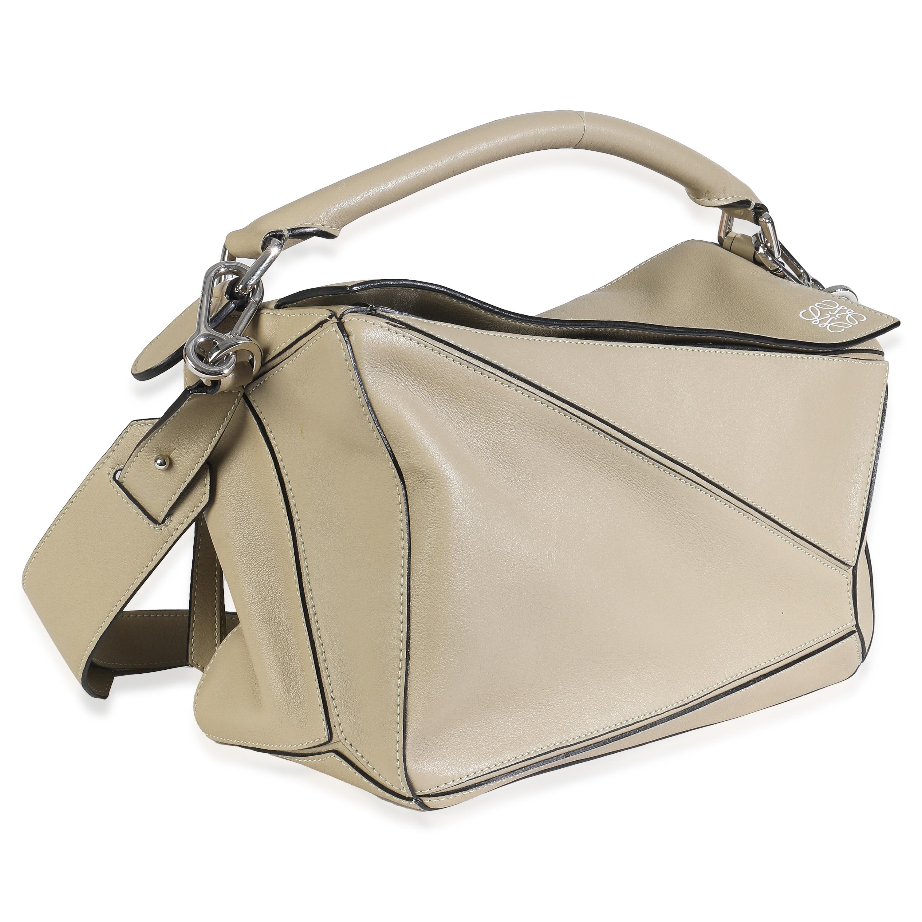Listing Title: Loewe Sand Smooth Calfskin Medium Puzzle Bag
SKU: 148017
MSRP: 4100.00 USD
Condition: Pre-owned 
Handbag Condition: Very Good
Condition Comments: Item is in very good condition with minor signs of wear. Minor signs of wear at