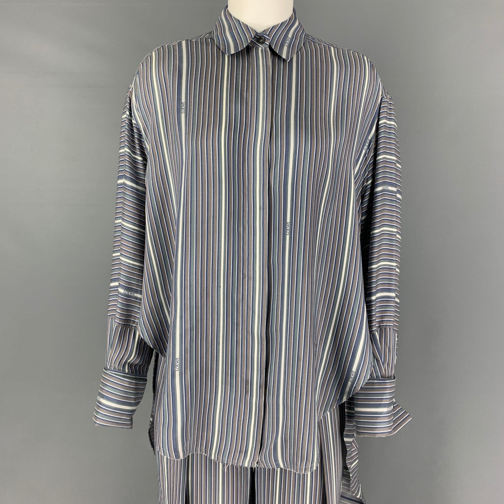 LOEWE set comes in a grey & blue striped silk featuring a trompe loeil high-low hem, pointed collar, loose fit,shirttail hem blouse and includes matching pull-on pleated balloon trousers. Made in Italy.
Excellent
Pre-Owned Condition. 

Marked:  