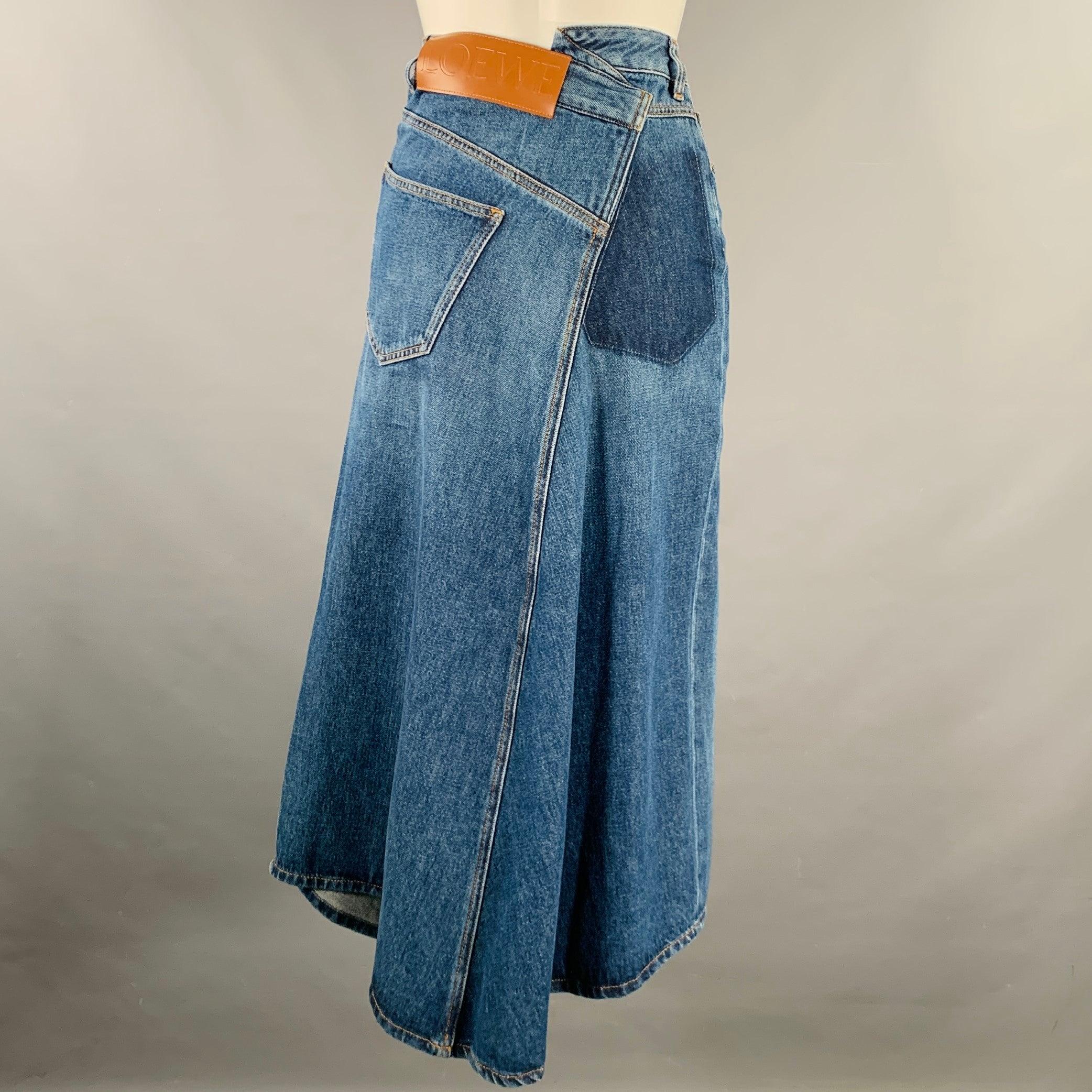 LOEWE skirt
in a blue cotton woven denim featuring a deconstructed denim jeans design, midi length, and asymmetrical zip fly closure. Excellent Pre-Owned Condition. 

Marked:   32 

Measurements: 
  Waist: 25 inches Hip: 35 inches Length: 34 inches