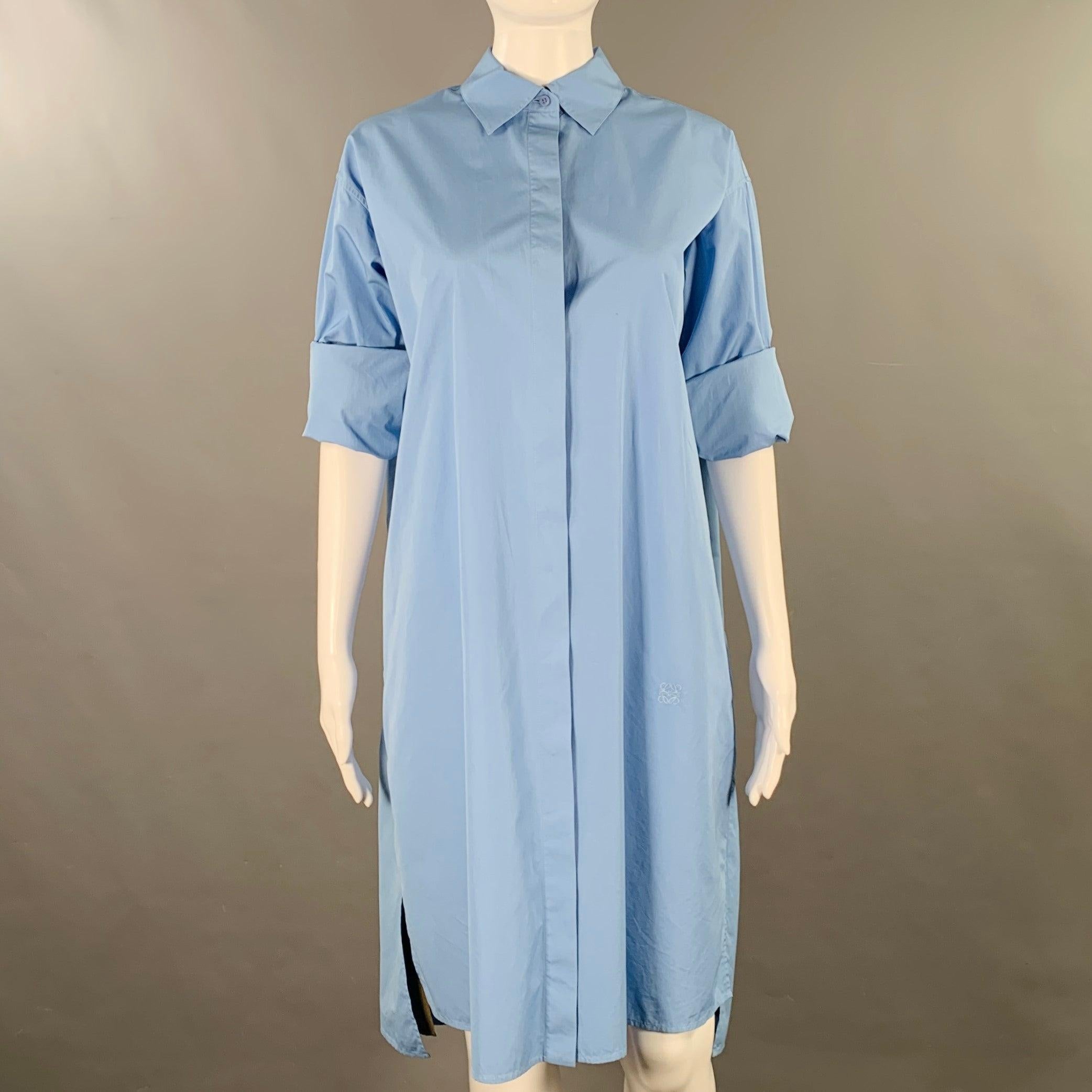 LOEWE shirt dress
in a blue cotton woven fabric featuring a spread collar, roll-tab sleeves with olive green peekaboo cuff detail, and hidden button closure. Made in Italy.Excellent Pre-Owned Condition. 

Marked:   FR 36 

Measurements: 
 
Shoulder: