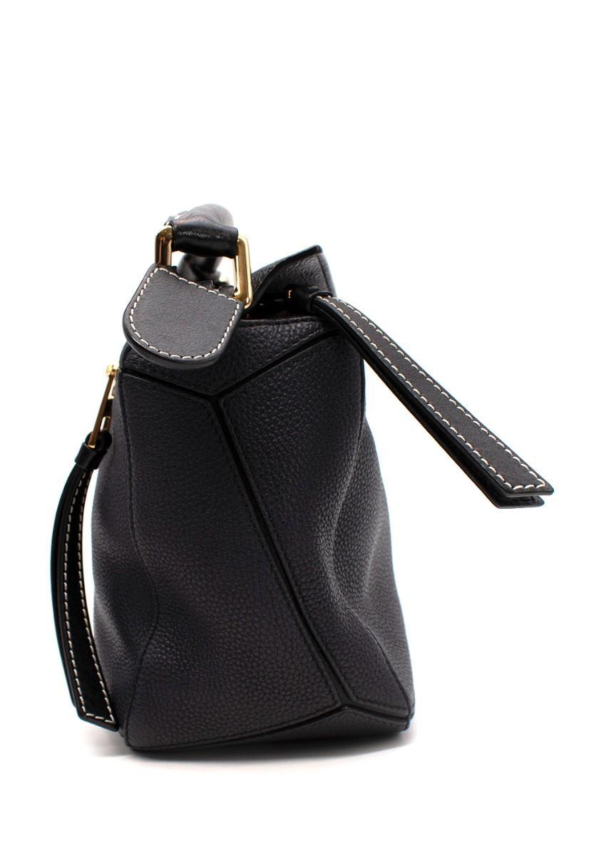 Loewe Small Puzzle Navy Calfskin Leather Bag

- Iconic Loewe style, featuring multiple leather panels
- Adjustable shoulder strap and one top handle
- Herringbone-patterned cotton-canvas lining
- Two internal slip pockets
- Gold-tone hardware
-