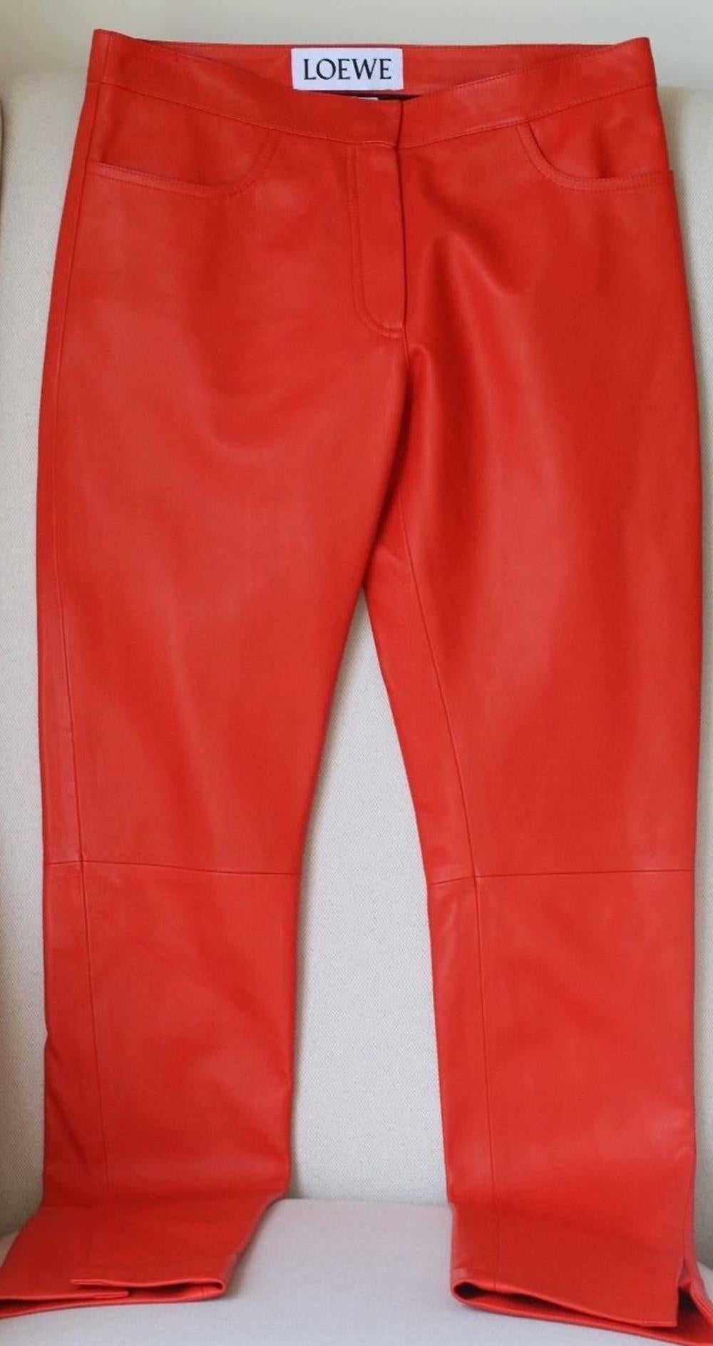 These red Loewe trousers are are a veritably stand-out piece from the brand's new season collection (thank you Jonathan). Crafted in Spain from sumptuous leather, the trousers have been designed in a vibrant red hue. 100% Lambskin leather.

Size: FR