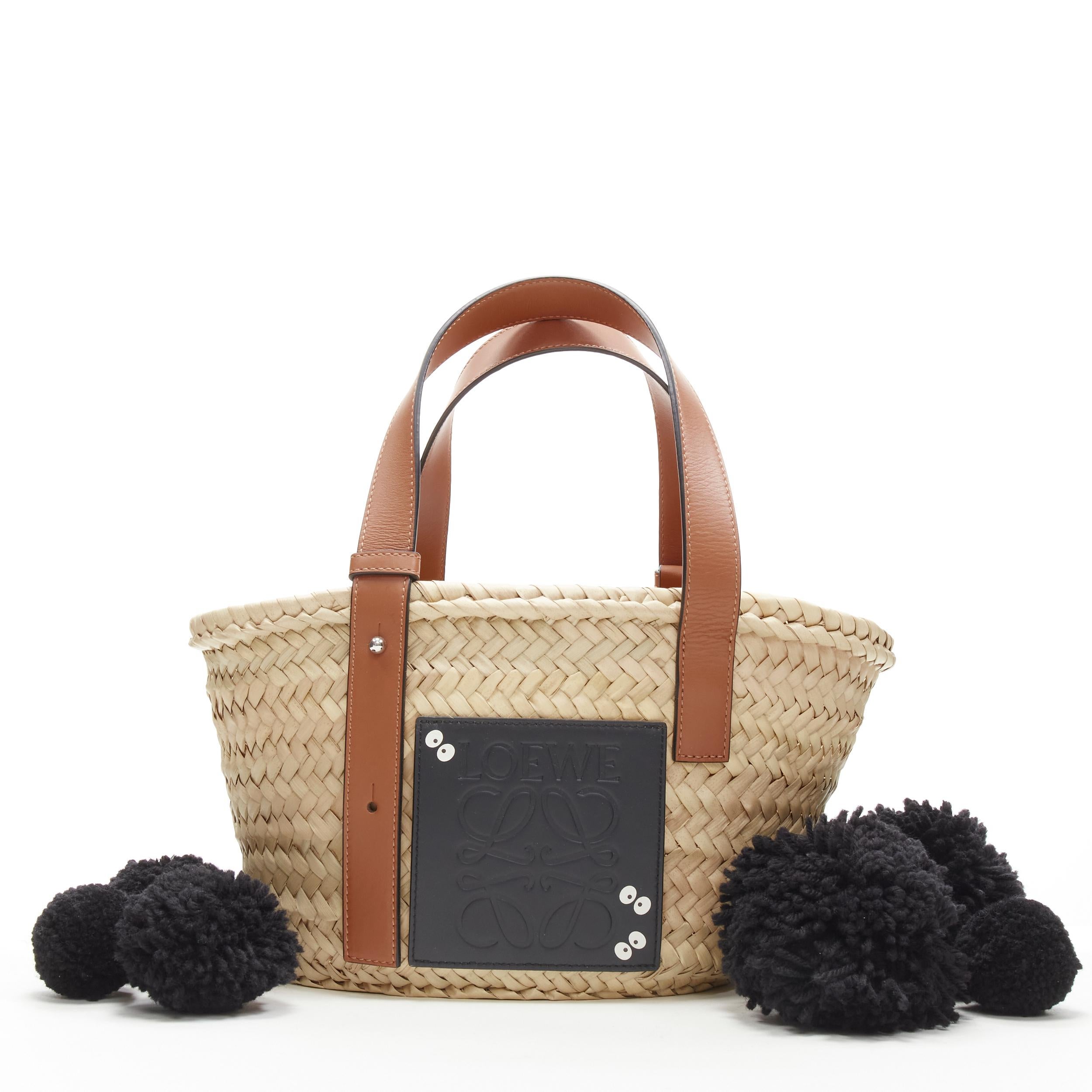 LOEWE Studio Ghibli Totoro Dust Bunnies Anagram logo small raffia basket bag
Reference: ANWU/A00025
Brand: Loewe
Designer: JW Anderson
Collection: Studio Ghibli collaboration
Material: Raffia, Leather
Color: Brown, Black
Pattern: Solid
Extra