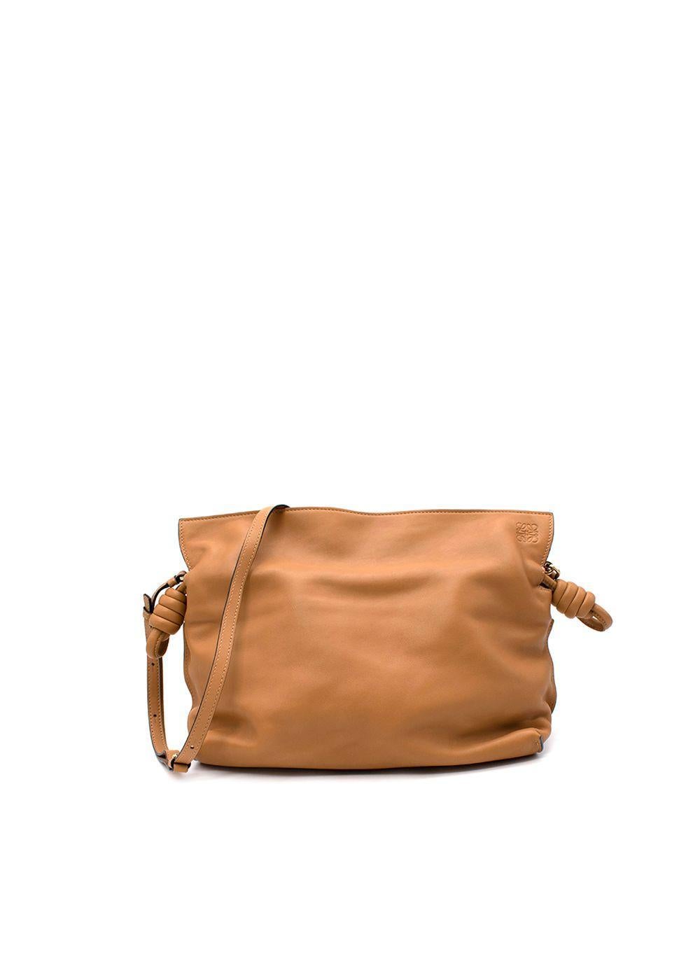 Loewe Tan Brown Leather Mini Flamenco Knot Clutch Bag

- Rolled leather drawstring cinch closure with coiled knots
- Removable crossbody strap
- Subtle magnetic closure
- Suede lined
- Embossed anagram logo

Materials:
Calfskin

Made in
