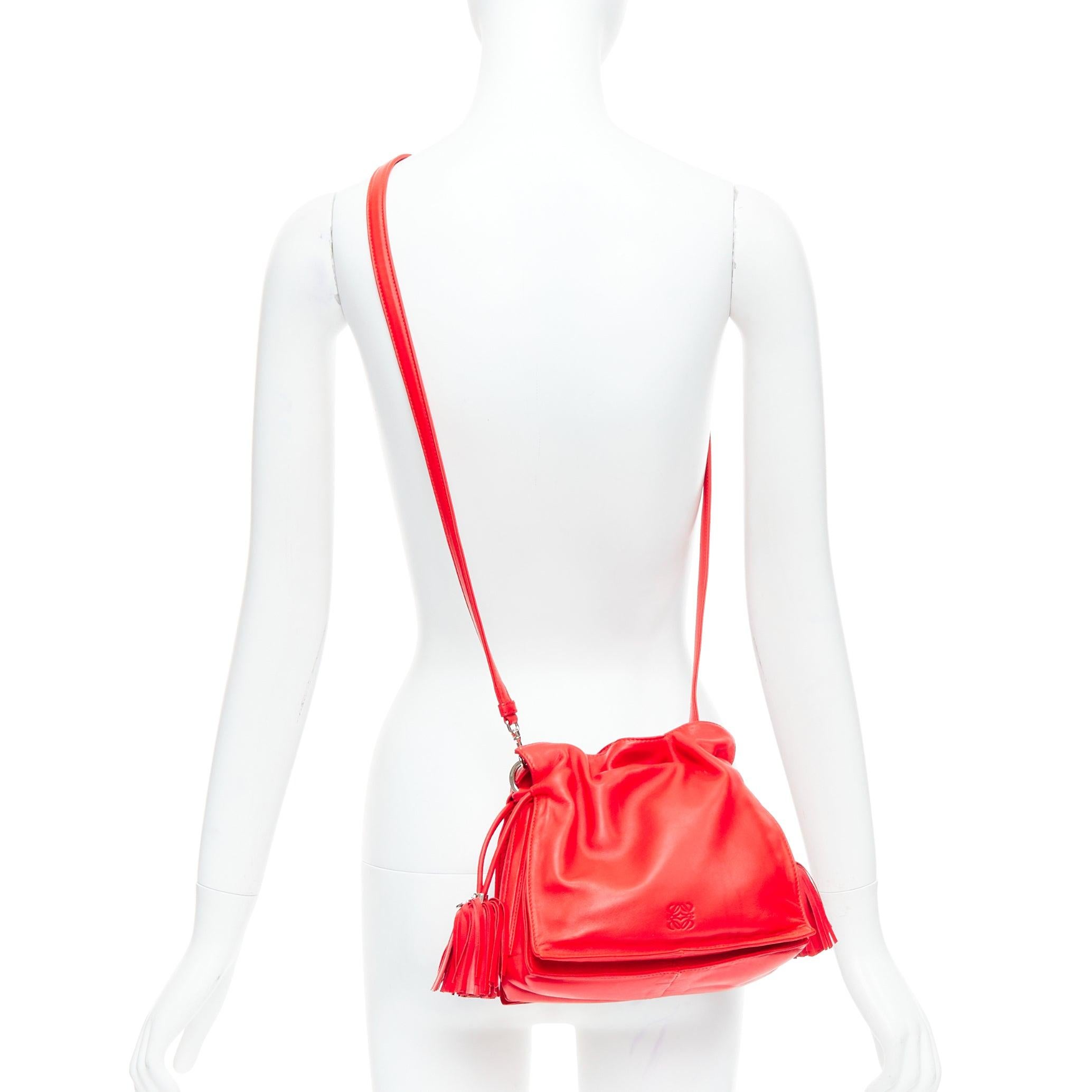 LOEWE Vintage Flamenc Tassel red soft leather anagram crossbody bucket bag
Reference: ALCU/A00036
Brand: Loewe
Material: Leather
Color: Red, Silver
Pattern: Solid
Closure: Drawstring
Lining: Nude Fabric
Extra Details: Red Leather. Silver-Tone