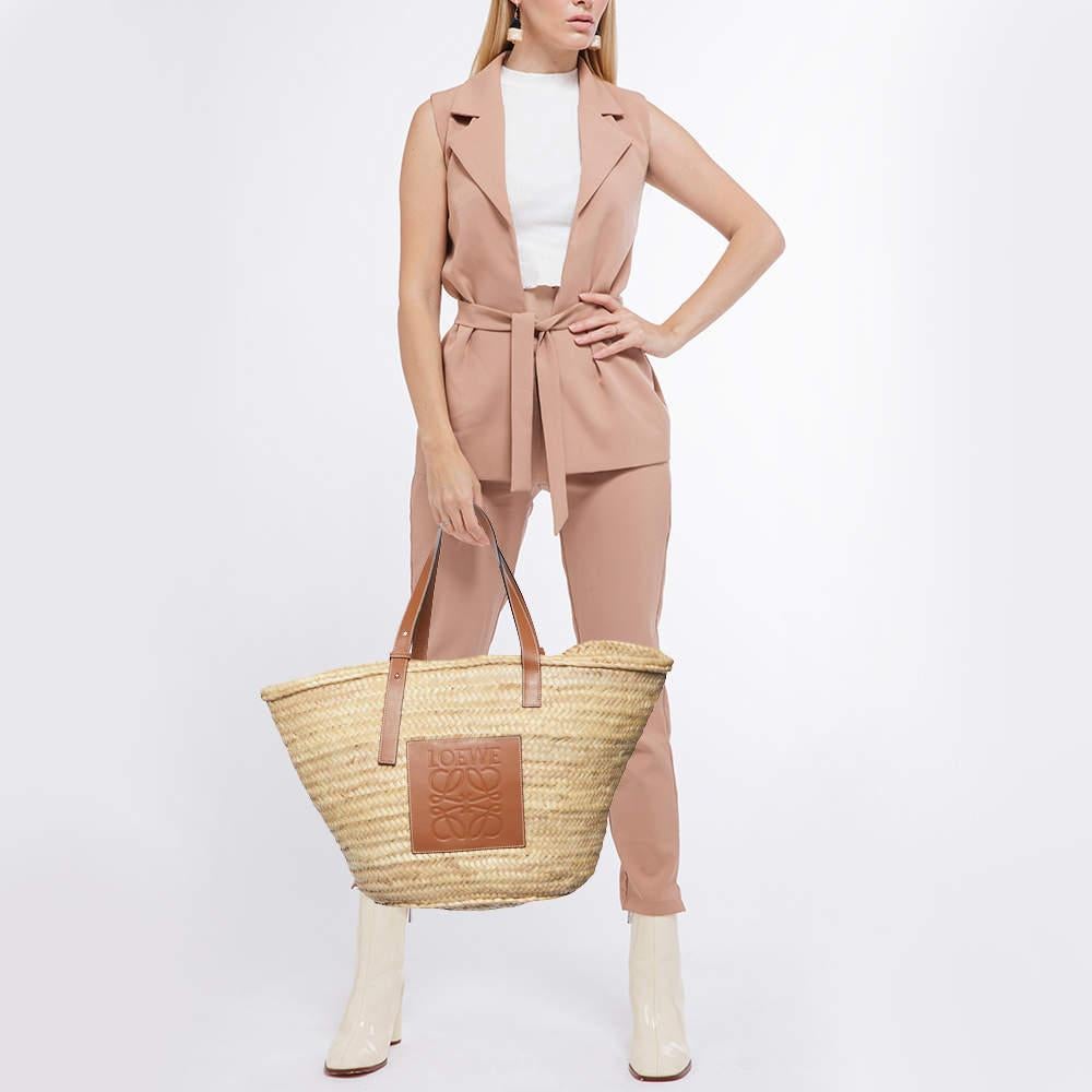 Perfect for conveniently housing your essentials in one place, this Loewe basket tote is a worthy investment. It has notable details and offers a look of luxury.

Includes
Original Dustbag
