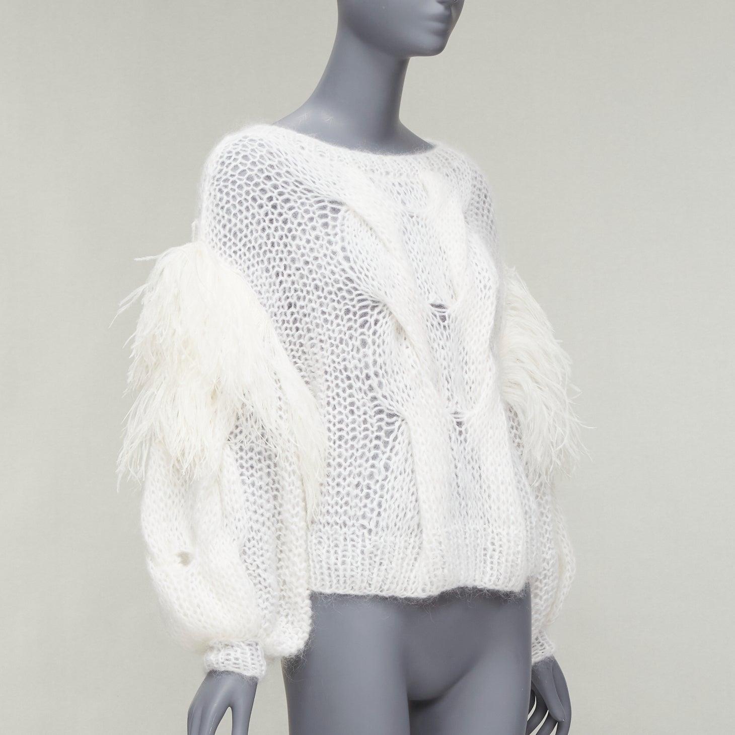 LOEWE white ostrich feather trim mohair loose cable knit jumper XS
Reference: AAWC/A00657
Brand: Loewe
Designer: JW Anderson
Model: 2022
Material: Mohair, Blend, Feather
Color: White
Pattern: Solid
Closure: Slip On
Extra Details: White mohair wool