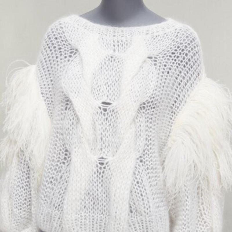 LOEWE white ostrich feather trim mohair loose cable knit jumper XS
Reference: AAWC/A00657
Brand: Loewe
Designer: JW Anderson
Model: 2022
Material: Mohair, Blend, Feather
Color: White
Pattern: Solid
Closure: Slip On
Extra Details: White mohair wool