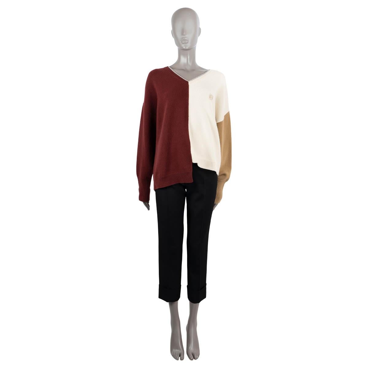 100% authentic Loewe colorblock sweater in burgundy, ivory, camel and grey wool (100%). Feaures a V-neck, asymmetric hem linen, Anagram embroidery at the chest and rib knit cuffs and hem. Has been worn and is in excellent condition.
