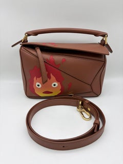 Loewe x Howl
s Moving Castle Studio Ghibli Puzzle Calcifer Small Tan Caramel