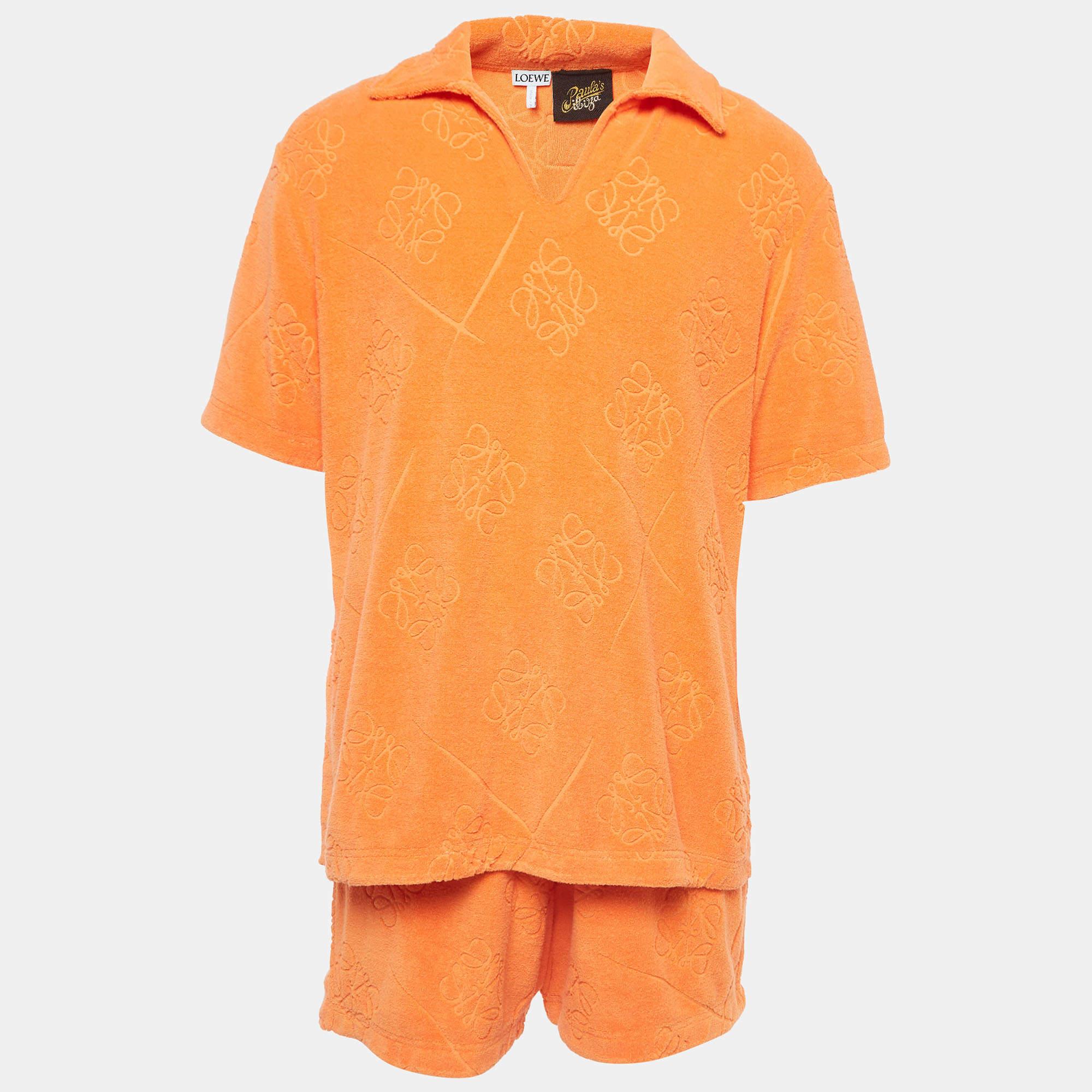 Loewe x Paula Ibiza collection is crafted with playful details and trendy colors. Crafted from terry cotton, this shirt & shorts set features orange anagram , short sleeves and a relaxed silhouette.

