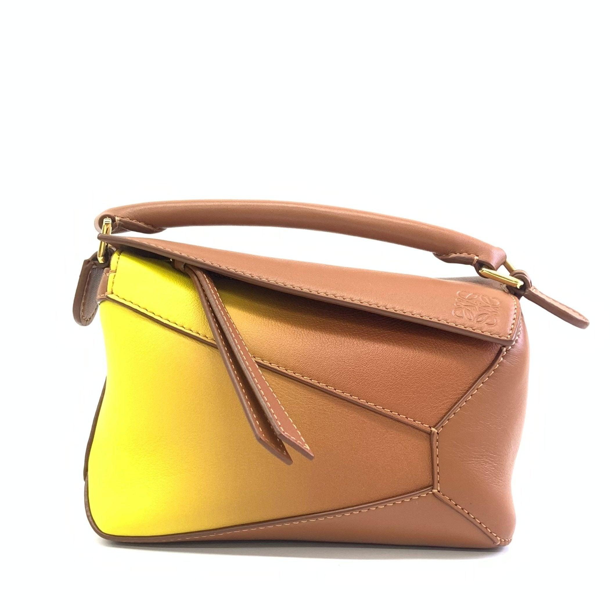 Loewe x Paula's Ibiza Degrade Puzzle Edge Mini Leather Lemon and Tan Crossbody Bag
These are professional photos of the actual bag.
  
  Loewe's Puzzle bag is a timeless classic cult piece. Crafted from supple calfskin leather and finished with