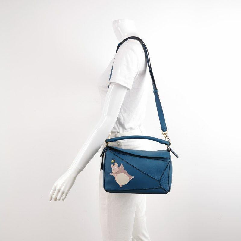 Loewe x Spirited Away Studio Ghibli Collection Puzzle Small Blue Crossbody Bag
 These are professional photos of the actual bag.
 
 This is from the sell-out collaboration between Loewe and the Japanese anime studio Studio Ghibli. This particular