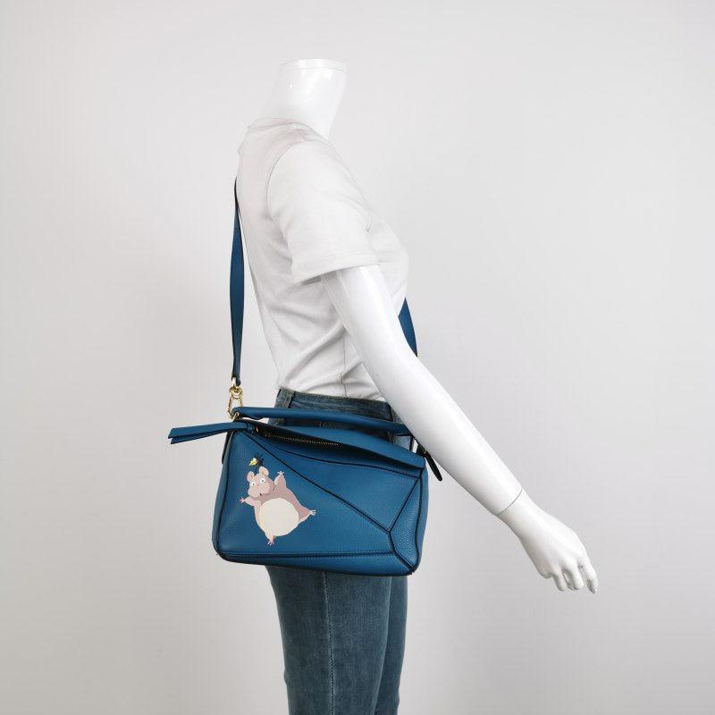 Loewe x Spirited Away Studio Ghibli Collection Puzzle Small Blue Crossbody Bag
  These are professional photos of the actual bag offered by Luxbags.
  
  This is from the sell-out collaboration between Loewe and the Japanese anime studio Studio