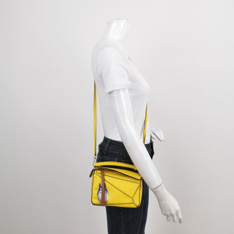 Loewe x Totoro Studio Ghibli Collection Puzzle Mini Yellow
  These are professional photos of the actual bag offered by Luxbags.
  
  This is from the sell-out collaboration between Loewe and the Japanese anime studio Studio Ghibli. This particular
