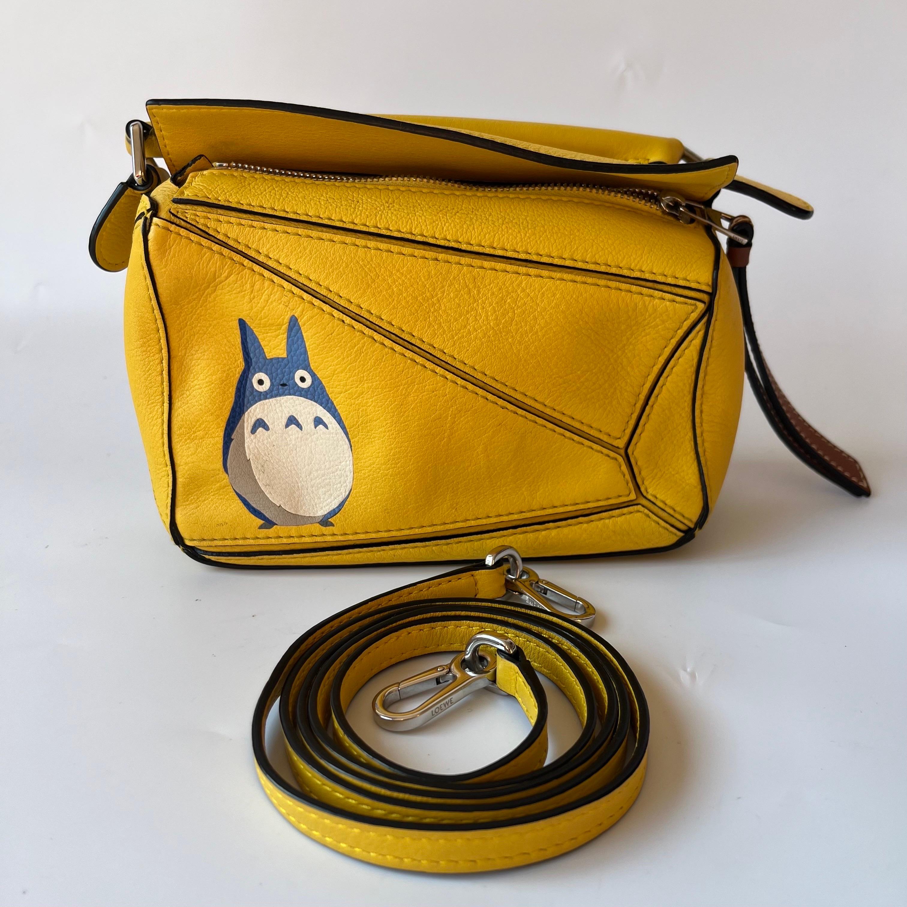 Loewe x Totoro Studio Ghibli Collection Puzzle Mini Yellow
These are professional photos of the actual bag offered by Luxbags.

This is from the sell-out collaboration between Loewe and the Japanese anime studio Studio Ghibli. This particular mini