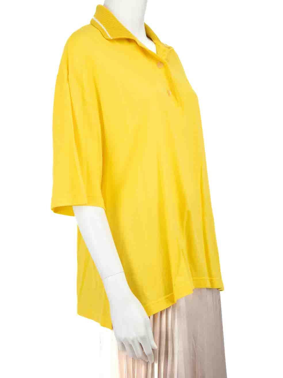 CONDITION is Good. Minor wear to shirt is evident. Light wear to the fabric surface with a handful of small discoloured marks found through the front of this used Loewe designer resale item.
 
 Details
 Yellow
 Cotton
 Polo shirt
 Short sleeves
