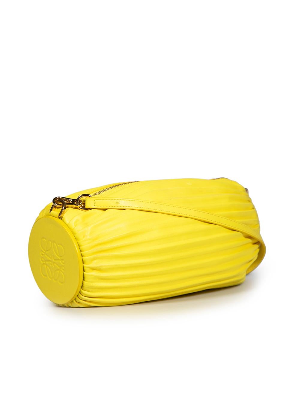CONDITION is Very good. Minimal wear to bag is evident. Minimal wear to the leather exterior with darkening and discoloured marks on this used Loewe designer resale item.
 
 Details
 Yellow
 Leather
 Convertible shoulder bag and bracelet
 Pleated