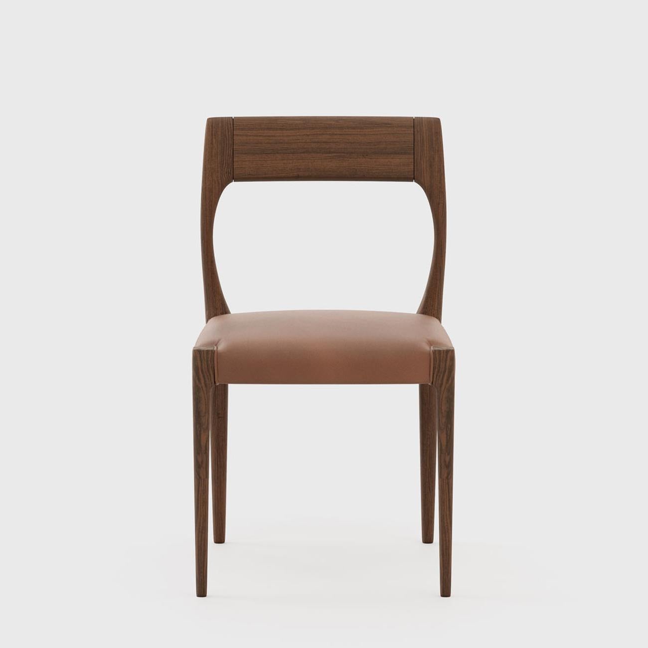 Chair Lofi with structure in walnut wood in matte finish,
with seat upholstered and covered with red earth leather.
Also available with other leather or fabric, on request.