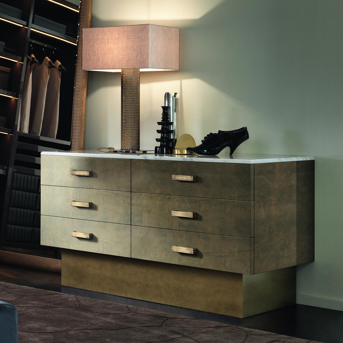 In a stunning design, the Loft Double 6-drawer Dresser is composed of a plywood structure and a wooden top in hemp lacquer finish, the base is lacquered effect brass and the handles are burnished brass.




 