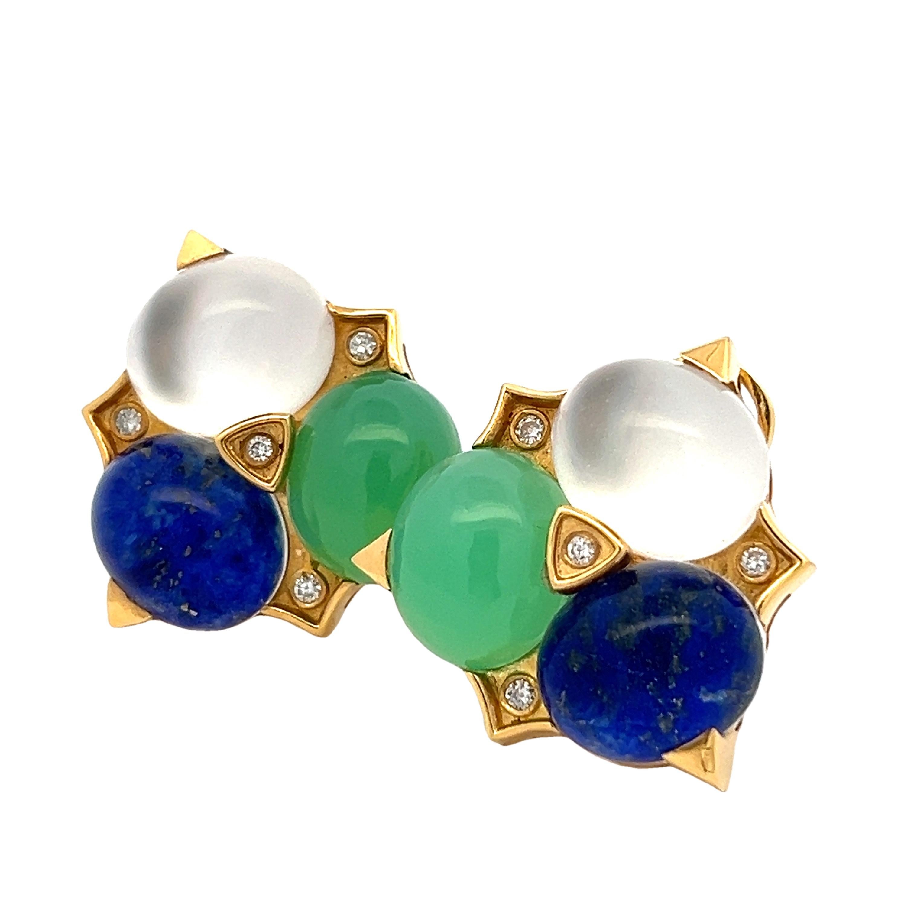 These exquisite clip-on earrings by Logan Hollowell are a bold statement of celestial color and craftsmanship. Crafted in 18 karat yellow gold and signed LH NYC, the design showcases an extraordinary trio of gem cabochons in vibrant green