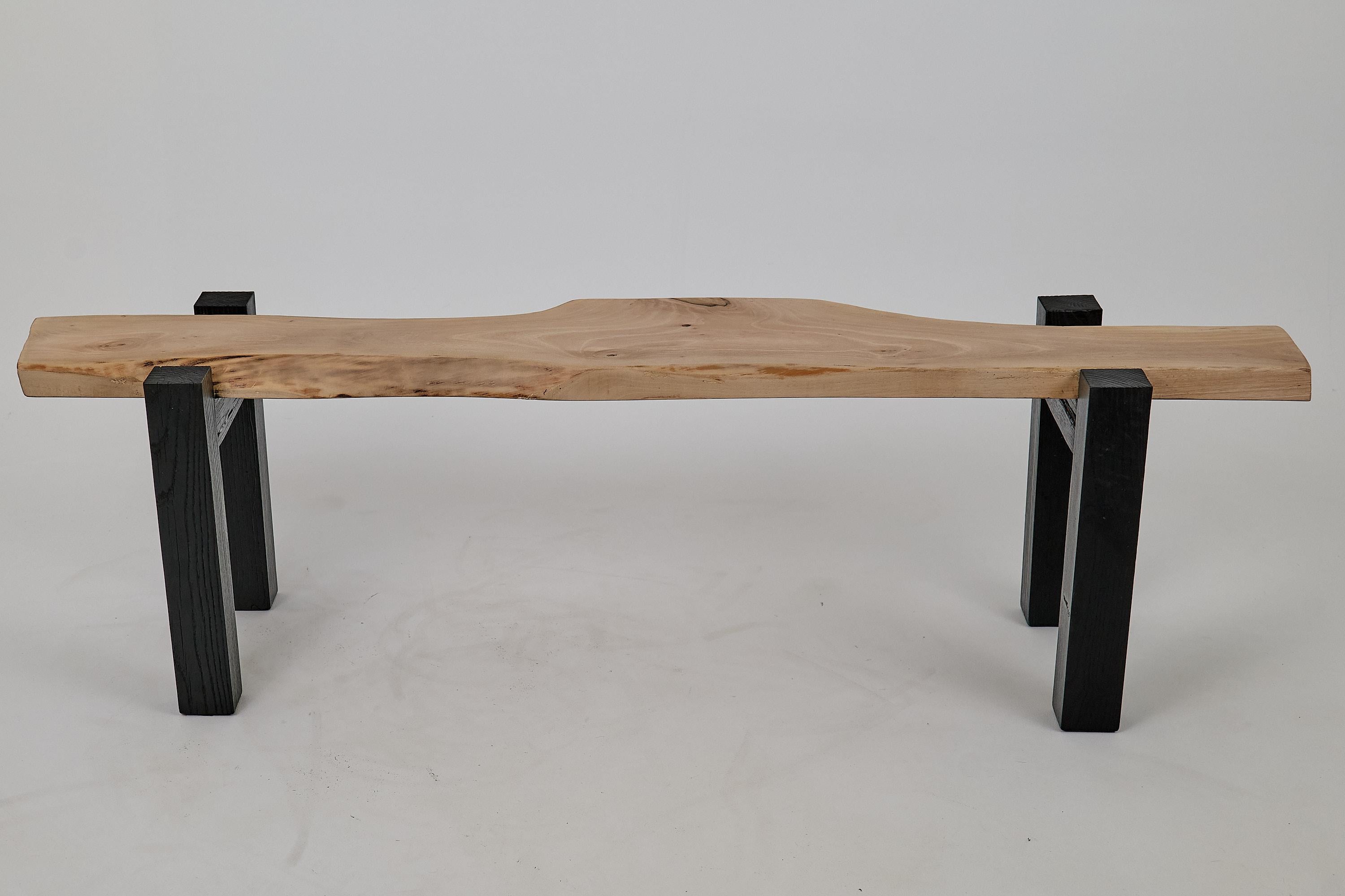 Unique live edge bench made from walnut plank and charred oak legs. Protected with the highest quality oils, ensuring durability for generations. Natural, eco-friendly and easy to maintain. Such unique handmade design will highlight your interior