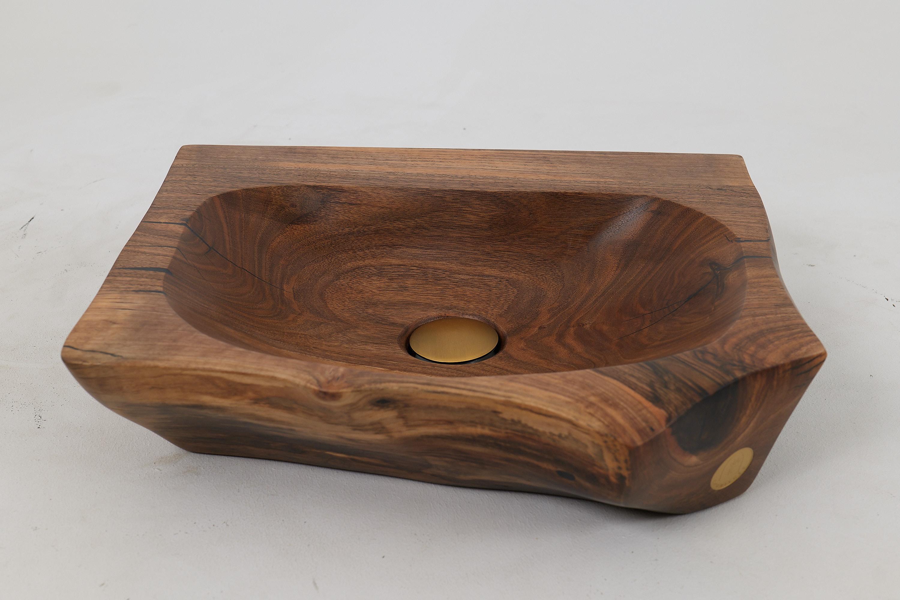 Handmade carved walnut sink, a stunning blend of natural beauty and artisanal craftsmanship. This unique piece features a rich, warm walnut finish that highlights the intricate carvings, making it a focal point in any bathroom.  Each sink is
