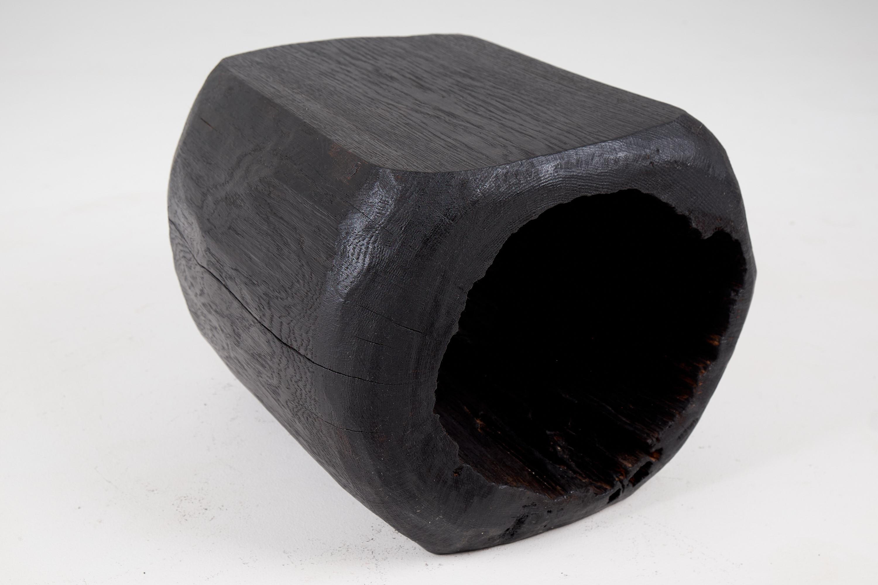 Chainsaw carved stool. Carved from a single piece of burnt oak wood and protected with the highest quality oils, ensuring durability for generations. Such unique handmade design will highlight your interior and bring comfort to your home, which