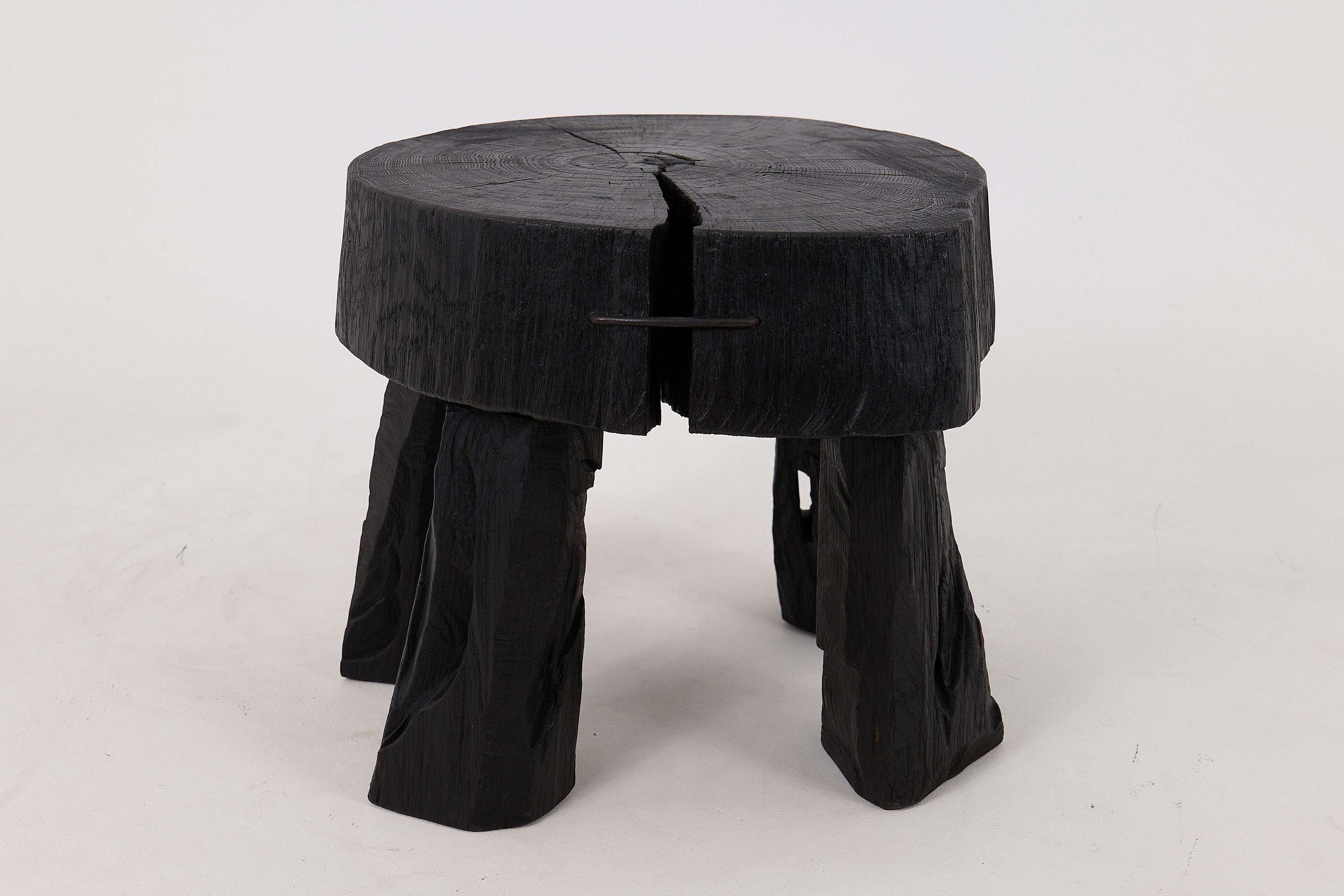 Chainsaw carved coffee table. Carved from a single piece of burnt oak wood and protected with the highest quality oils, ensuring durability for generations. Such unique handmade design will highlight your interior and bring comfort to your home,