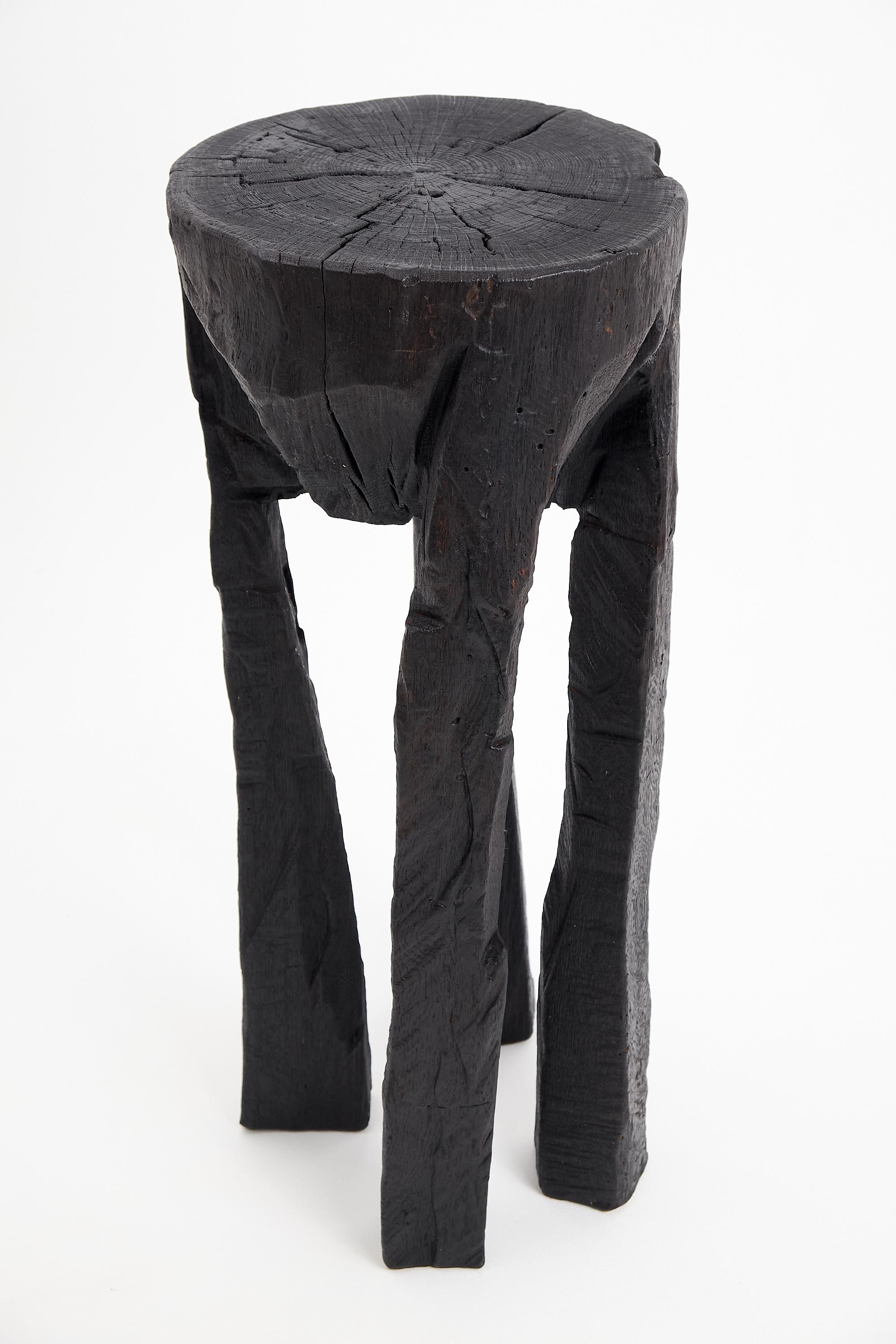 Chainsaw carved side table/wine table/pedestal. Carved from a single piece of burnt oak wood and protected with the highest quality oils, ensuring durability for generations. Such unique handmade design will highlight your interior and bring comfort