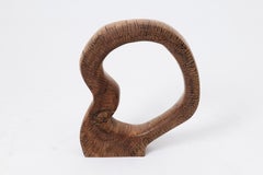 Logniture, scultura astratta in legno, intagliata con la motosega, noce