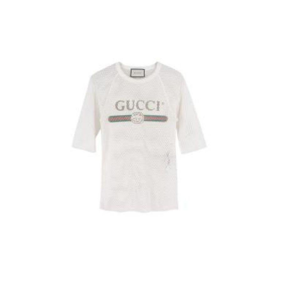 Gucci Printed Logo White Perforated T-Shirt
 

 - Light weight cotton body
 - Printed Gucci logo 
 - Perforated detail 
 - Half sleeves 
 - Ribbed crew neck
 - Raw edges 
 

 Materials:
 100% Cotton 
 

 Made in Italy 
 

 Hand wash or dry clean