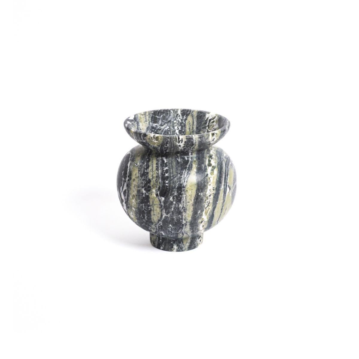 Introducing the Loki Orb Vase, a one of a kind marble vase designed for long-lasting pleasure. Each piece is unique, crafted from natural marble and finished with meticulous detail. This vase will bring a touch of elegance and sophistication to any