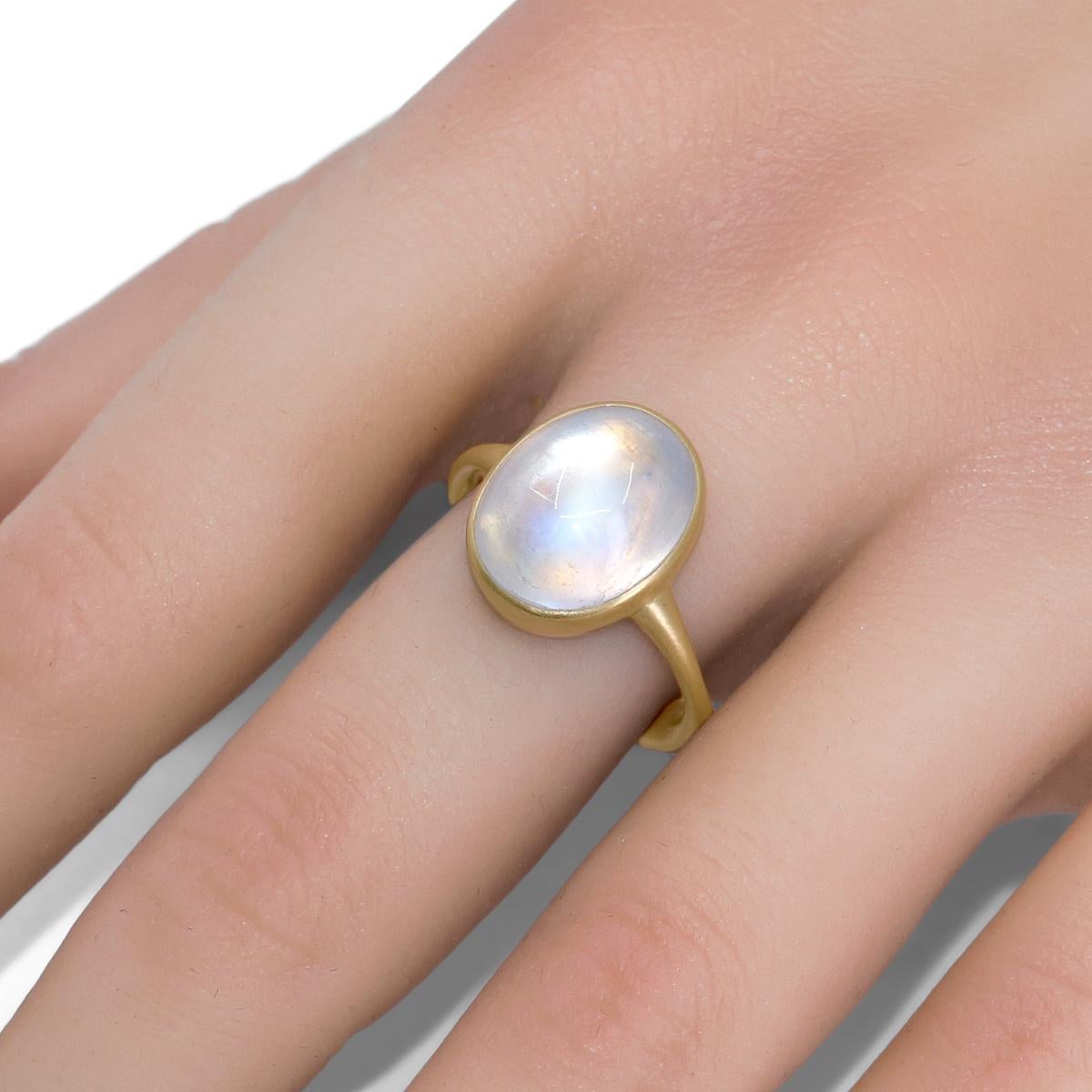 One of a Kind Ring handmade in signature-finished 18k yellow gold by jewelry artist Lola Brooks featuring a vibrant 7.04 carat oval rainbow moonstone cabochon, bezel-set atop a hand-fabricated tapered gold band. Size 7.0 (can be sized upon request).
